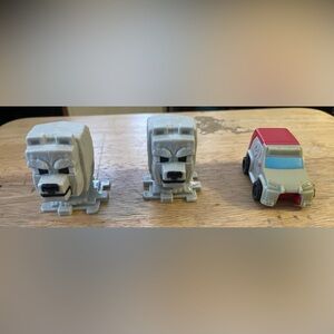 2-Minecraft Movie Happy Meal toys, specifically two "Dennis and 1-Ratchet